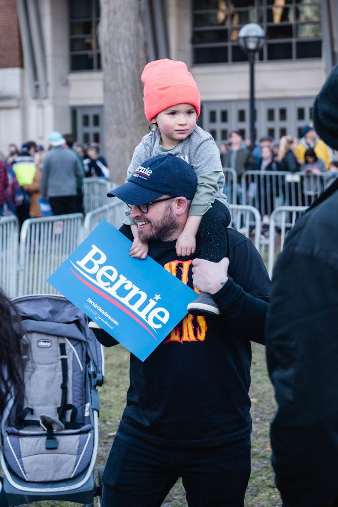 Bernie Sanders supporter Graham Parker and daughter Juniper wait for Sanders to take the stage at March 8 rally.
