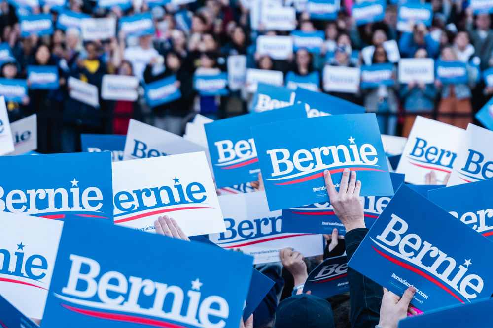 Supporters hold up signs at Bernie Sanders rally in Ann Arbor. Torrence Williams | Washtenaw Voice