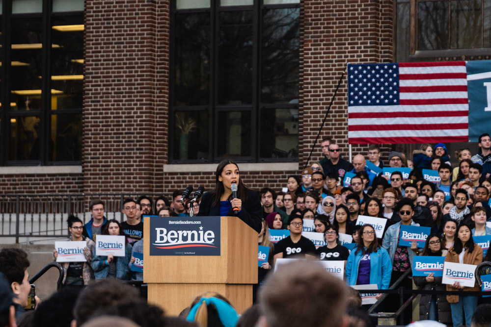 U.S. Rep and Bernie Sanders supporter Alexandria Ocasio-Cortez speaks at Sanders rally in Ann Arbor. Torrence Williams | Washtenaw Voice