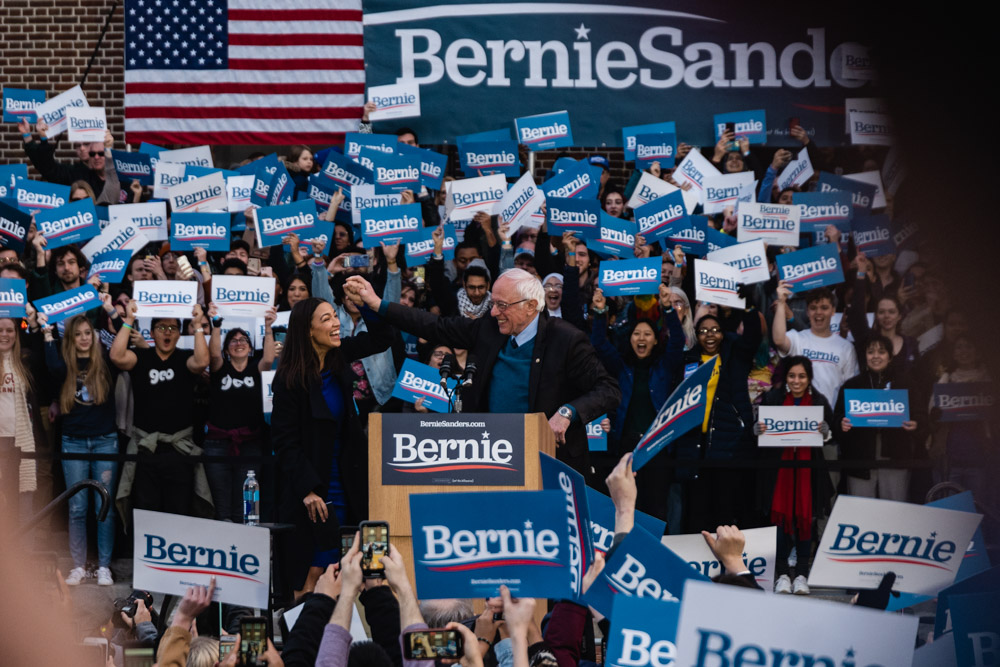 U.S. Rep. from New York Alexandria Ocasio-Cortez introduces Sen. and presidential candidate Bernie Sanders at March 8 rally in Ann Arbor.