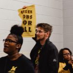 Protesters from the Sunrise Movement demanding support of the Green New Deal are escorted out of Joe Biden's rally.