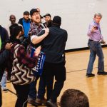 Anti-NAFTA protester who disrupted presidential candidate Joe Biden's speech is escorted out of the venue by police.