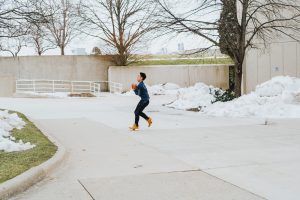 Anthony Merino catching a ball in front of the Student Center. Lilly Kujawski | Washtenaw Voice