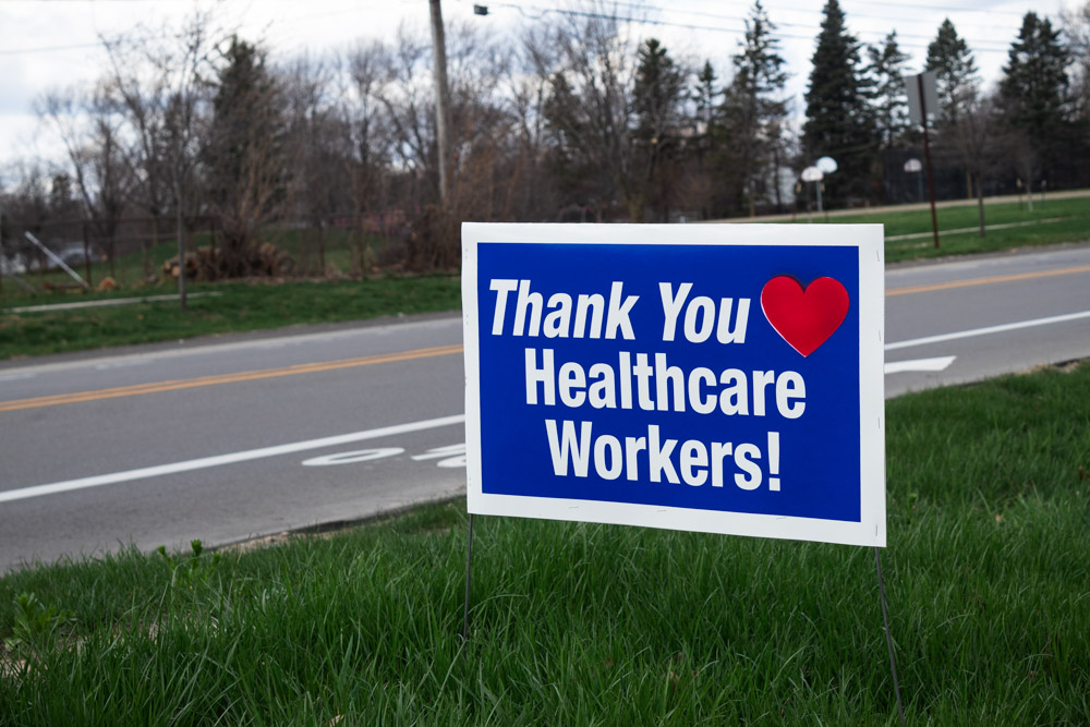 A sign placed on the side of the road thanks healthcare workers.