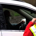 To minimize risk, Red Cross volunteers have to interact with donors while they are still in their cars. Torrence Williams | Washtenaw Voice