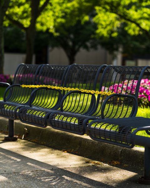 Benches and other public seating on campus are temporarily chained off due to COVID-19. Torrence Williams | Washtenaw Voice