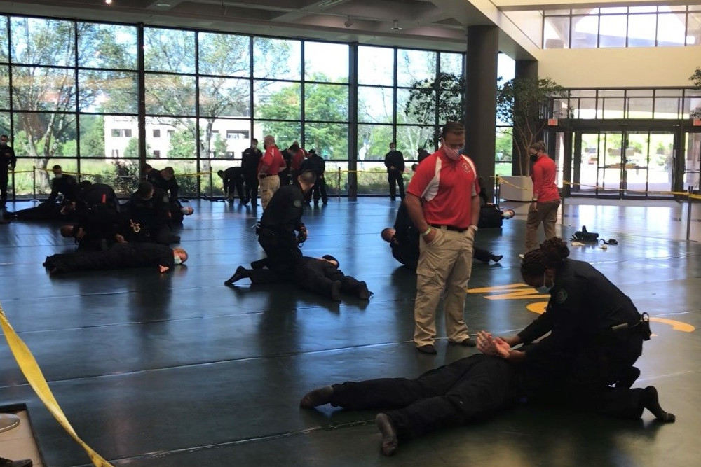 Police academy students train with one another in the converted Morris Lawrence atrium. Courtesy of Joyce Nelson VanMeter.