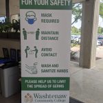 A sign outlines safety protocols to prevent spread of COVID. Cydney Heed | Washtenaw Voice