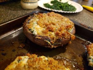 Portobello caps stuffed with mozzarella, cream cheese, spinach, and sun dried tomato with a bread crumb crust. Samantha Evens | Washtenaw Voice