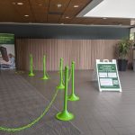 Barricades and floor stickers are set up in the TI building to aid in social distancing. Cydney Heed | Washtenaw Voice