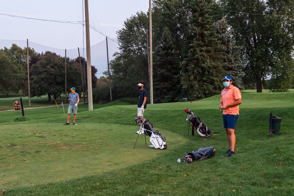 Golf club students John Feenbacher, Evan Peoples, and Jorge DiGivanni. Torrence Williams | Washtenaw Voice