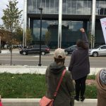 Cars honking as the march arrives at City Hall. Weevern Gong | Washtenaw Voice