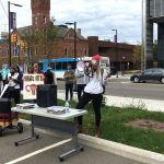 Organizers from Shine & Rise thanking the crowd and repeating the message to vote. Weevern Gong | Washtenaw Voice