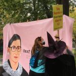People signing the Ruth Bader Ginsburg Banner. Weevern Gong | Washtenaw Voice