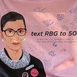 A poster of Ruth Bader Ginsburg, urging a delay of the next Supreme Court confirmation. Weevern Gong | Washtenaw Voice