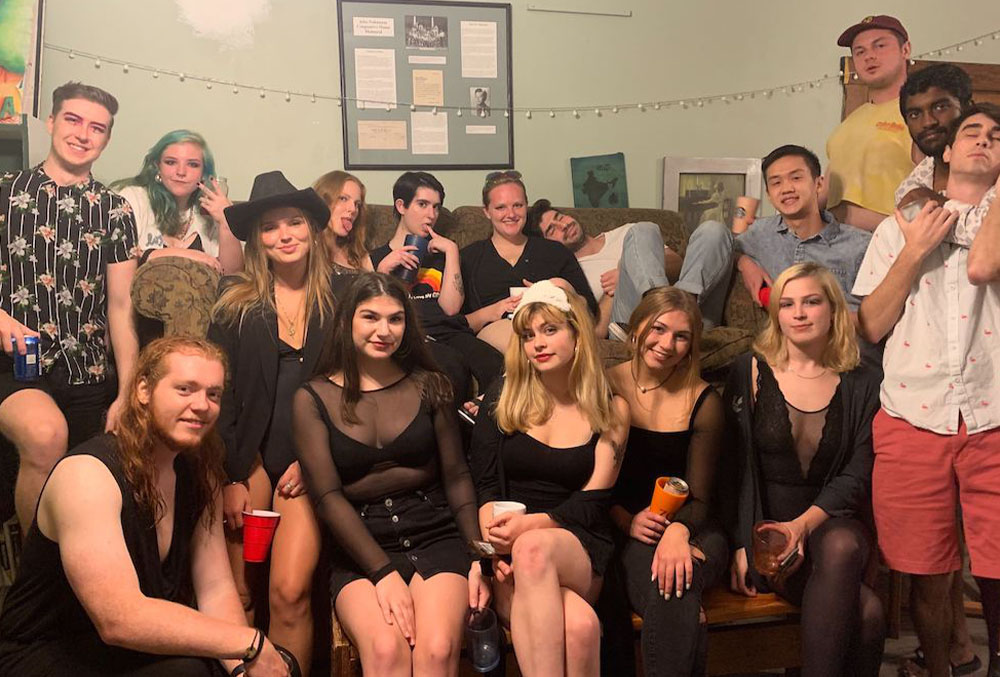 The house gathering for a photo before a party. When we leave the house, we wear masks. Xailia Claunch | Washtenaw Voice