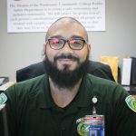 headshot of Maurice Stovall from the shoulders up smiling and sitting at a desk