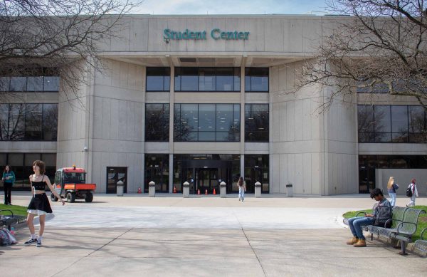The front entrance of WCC's Student Center. It is a large cement building with black window trim and a revolving door.