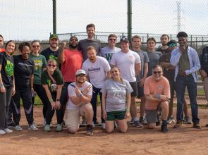 Staff and students pause for a game of kickball
