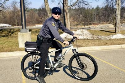Officer-Pasko-poses-on-a-WCC-Safety-Department-bike-1.jpg