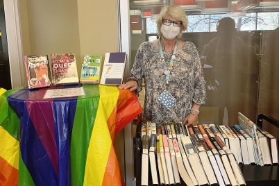 webBailey-Library-Access-Service-Technician-Cate-Karain-displayed-LGBTQ-books-for-attendees-to-check-out.-Courtesy-of-Mia-Lanier-Durkins-copy.jpg